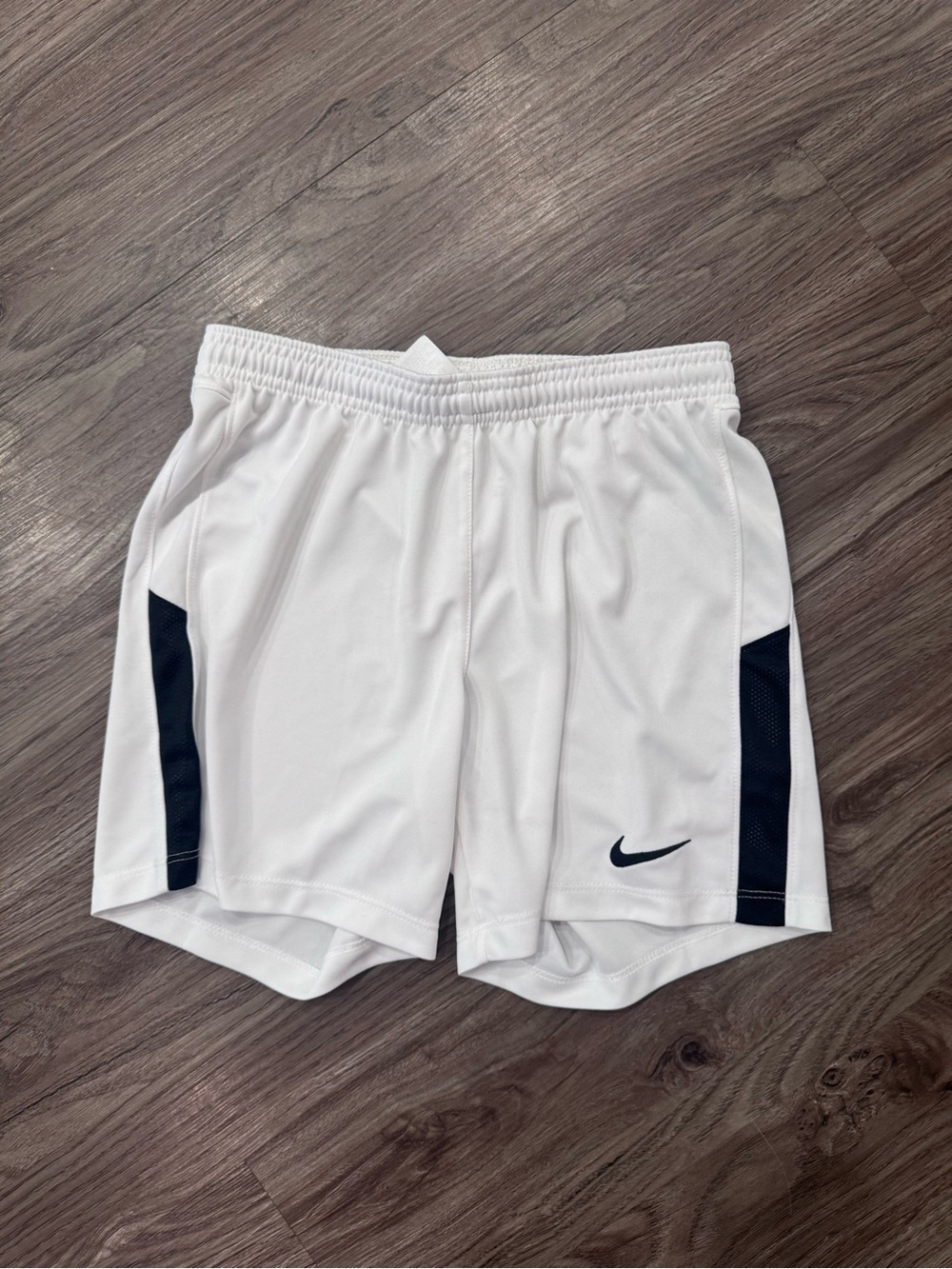 Nike White Athletic Shorts with Black Side Panels and Swoosh